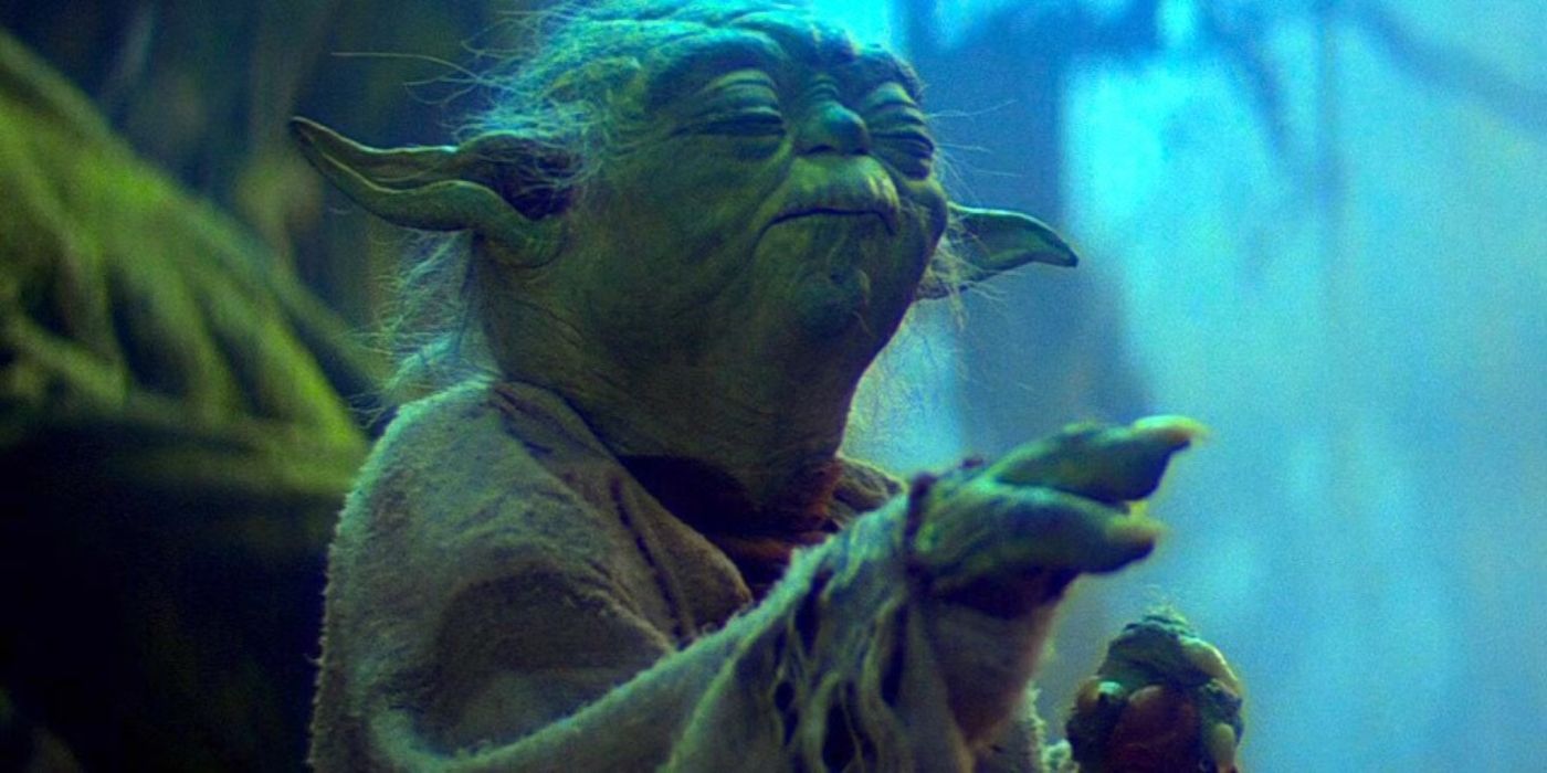 Yoda extends his hand out to use the force in Star Wars: The Empire Strikes Back.