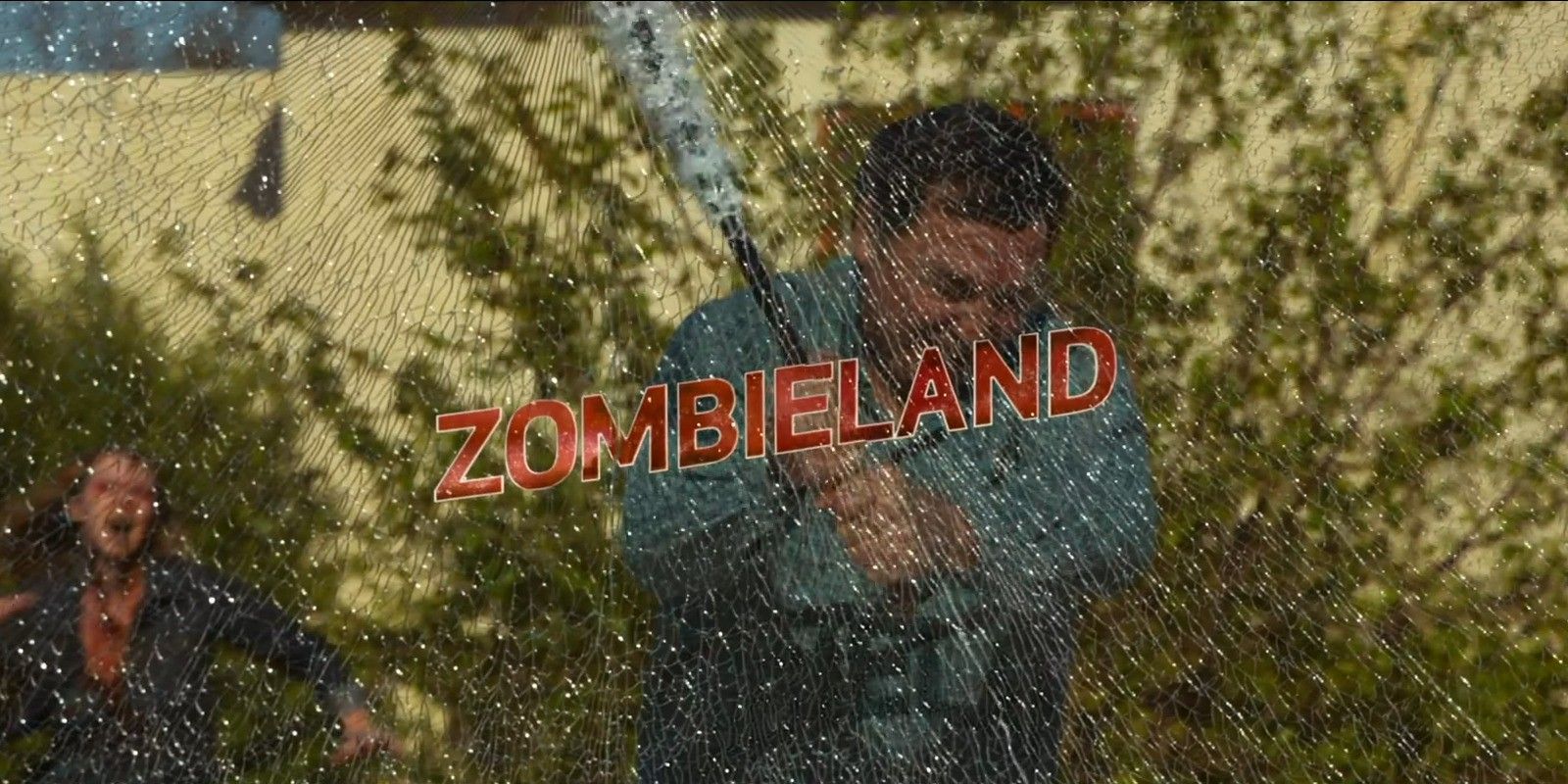 A man shattering a pane of glass including the text &ldquo;Zombieland&rdquo; in the title card for &lsquo;Zombieland&quot; (2009)