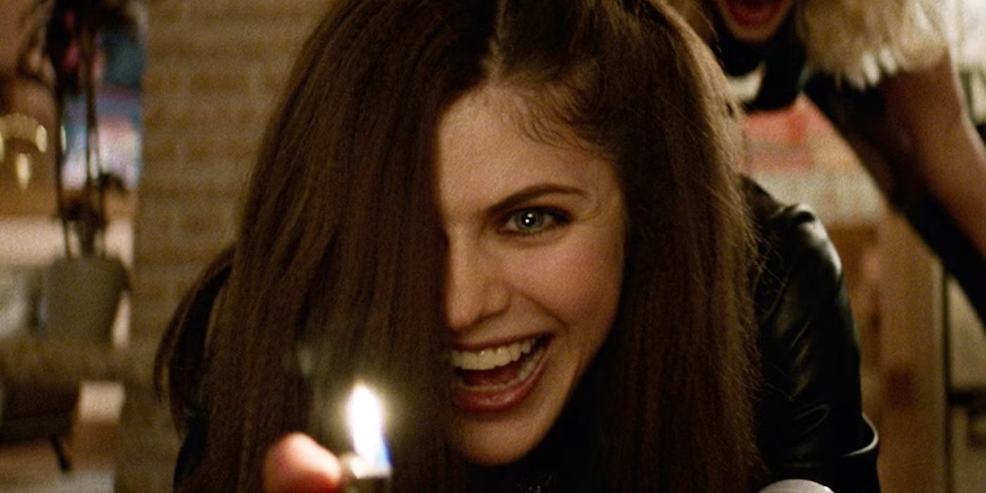 Alexandra Daddario as Alexis holding a lighter while smiling maniacally in We Summon the Darkness.