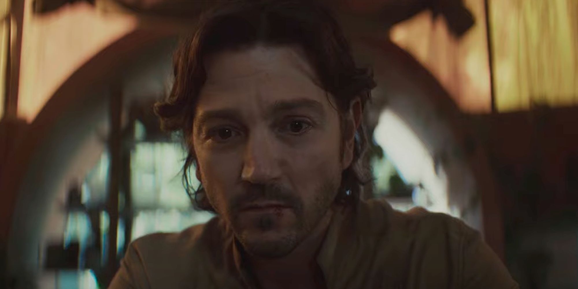 Cassian (Diego Luna) watching Bix's (Adria Arjona) goodbye in Andor Season 2 Episode 9.