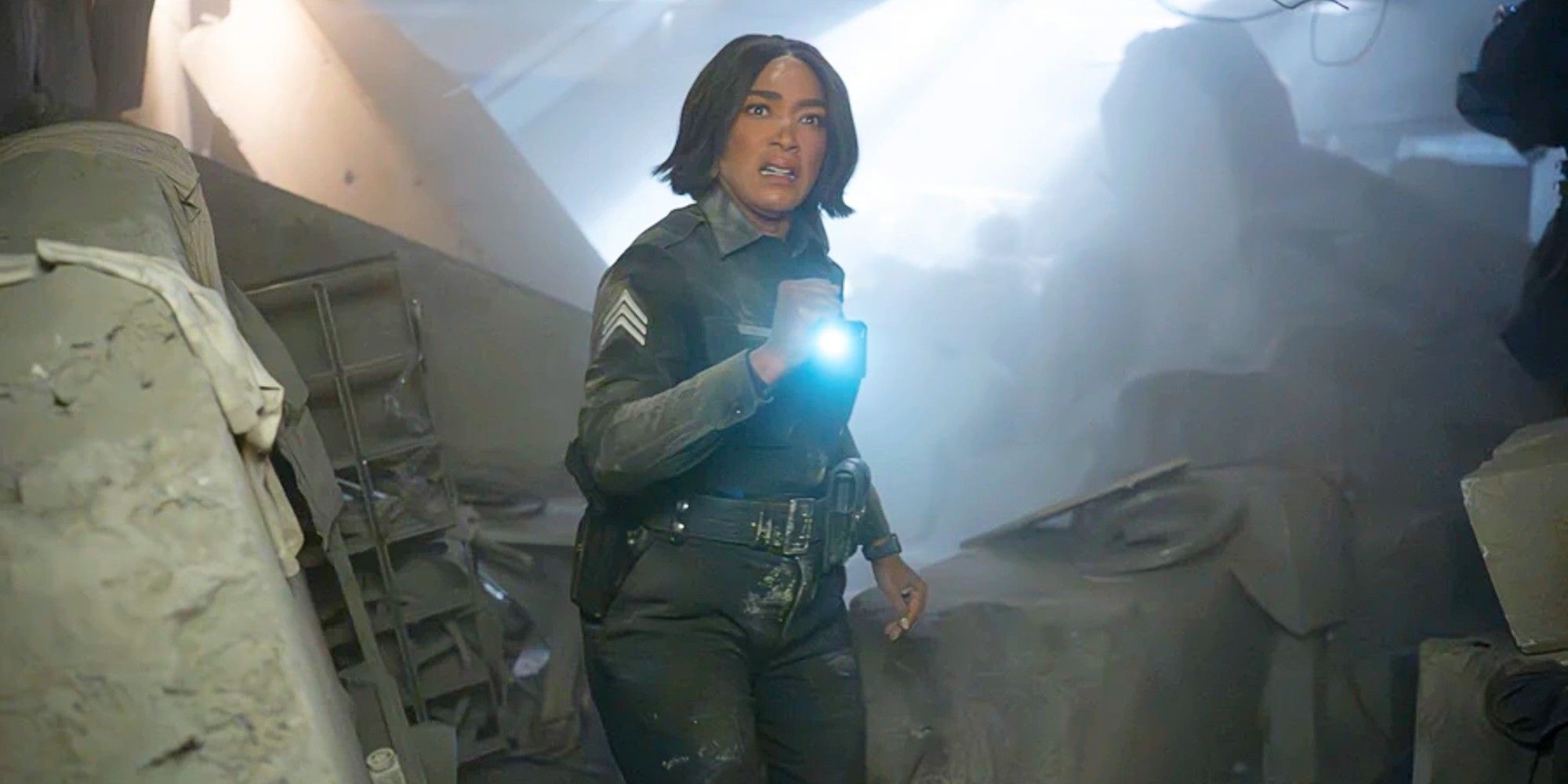 Angela Bassett as Athena Grant-Nash investigating a wreckage in the Season 8 finale of 9-1-1.