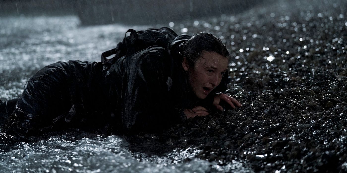Bella Ramsey as ellie crying in the rain in The Last of Us Season 2 Episode 7