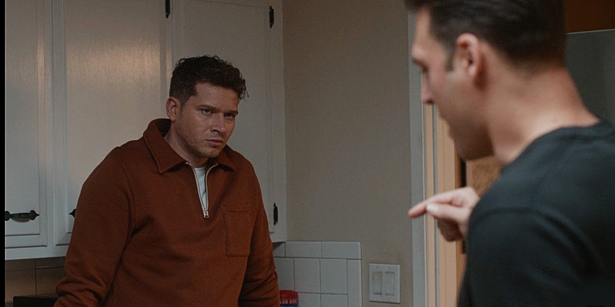 Buck and Eddie fighting in Eddie's kitchen in 9-1-1 Season 8