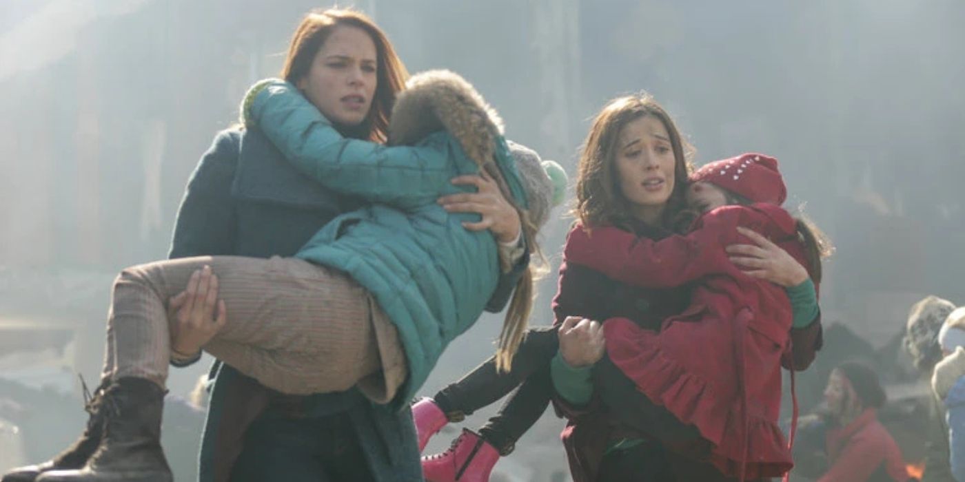 Two adults carrying children in their arms after a massive explosion on 'Chicago Fire.'