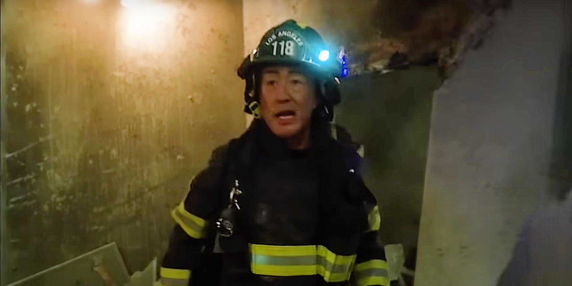 Kenneth Choi as Chimney Han tending to a wreckage in the Season 8 finale of 9-1-1