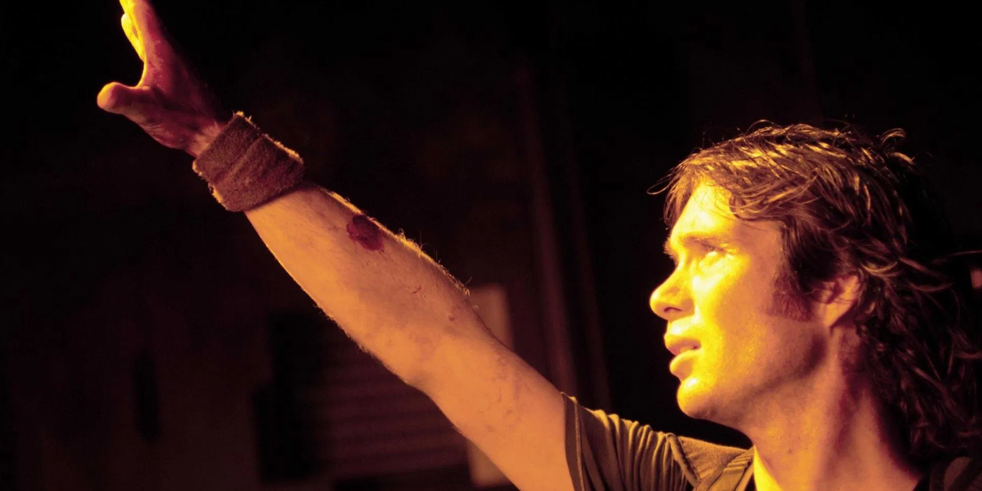 Cillian Murphy holds his right hand up in Sunshine