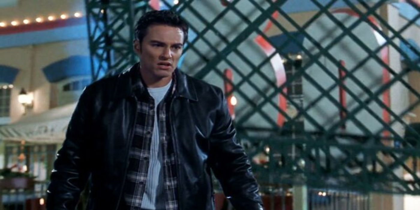 A billboard about to hit a young man in 'Final Destination' (2000)