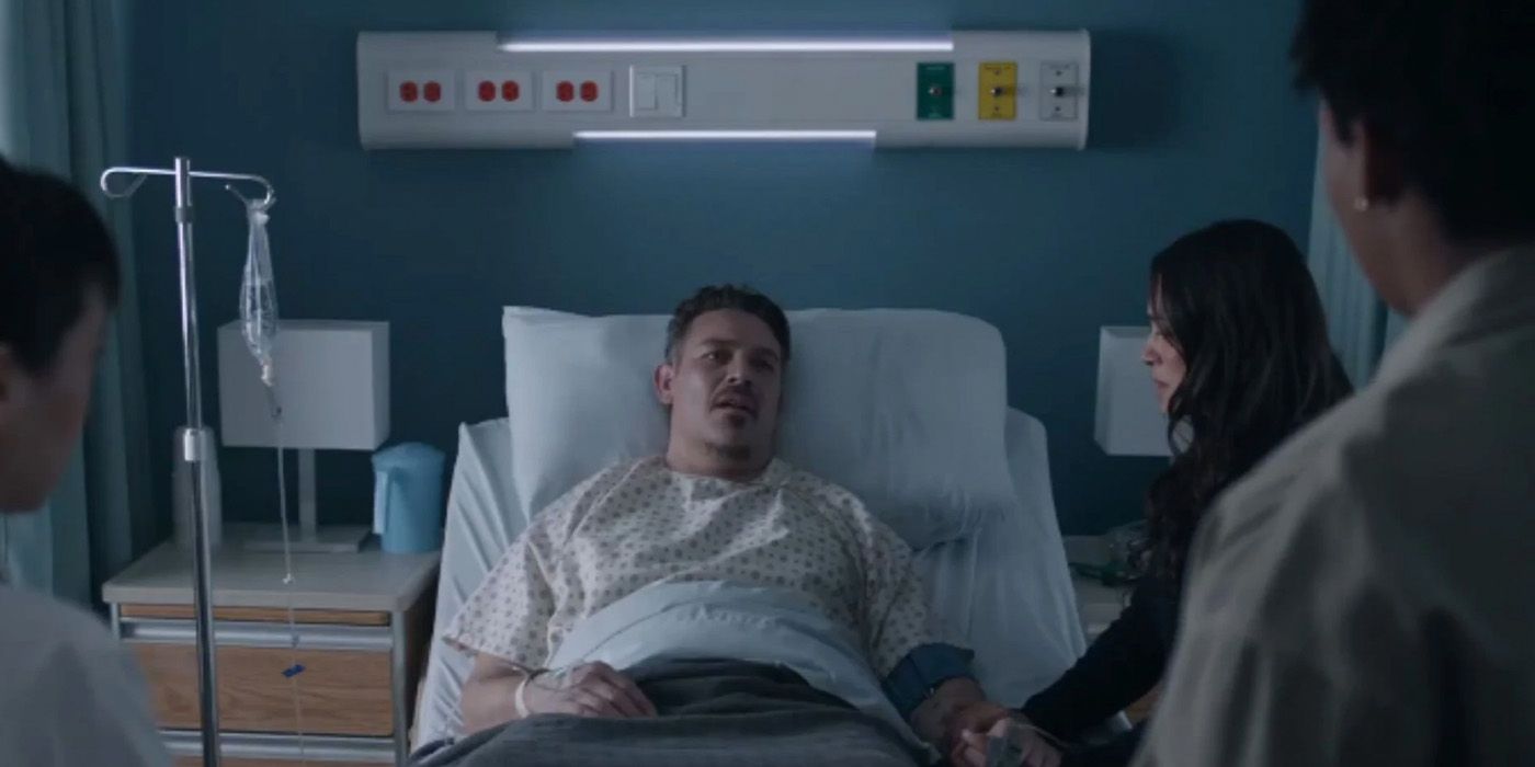 Manny Perez (Kevin Alejandro) lies sick in bed surrounded by friends and family on 'Fire Country'