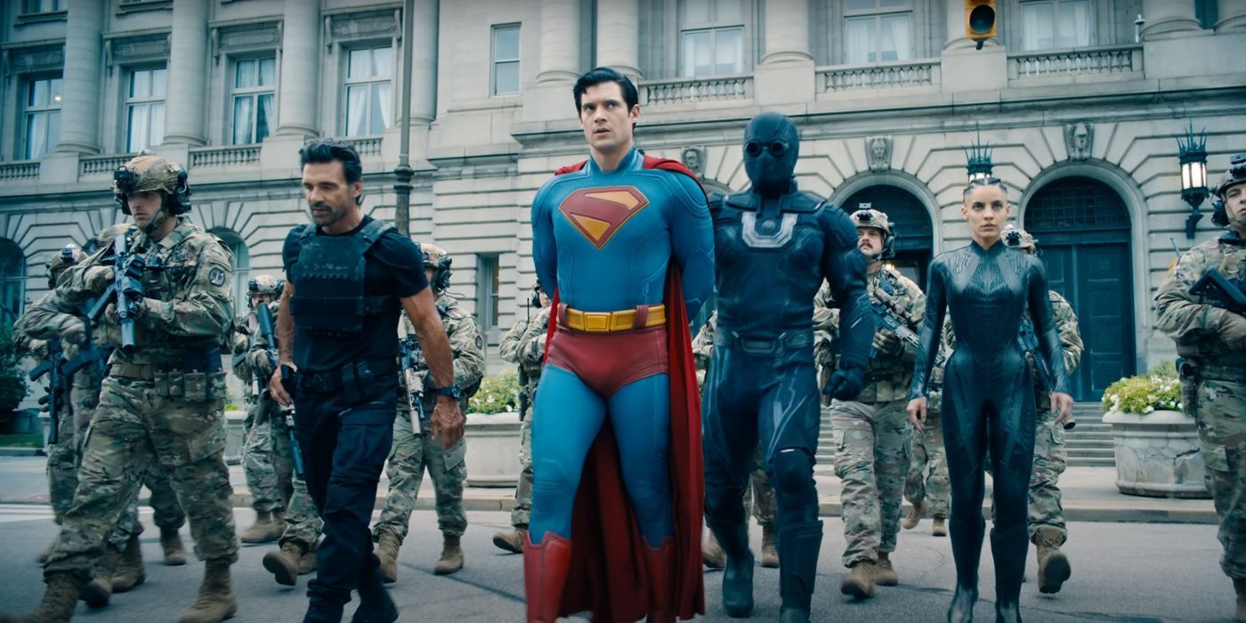 Frank Grillo, David Corenswet, and Maria Gabriela de Faria, as Rick Flag Sr, Superman, and the Engineer, walking next to Ultraman in Superman.