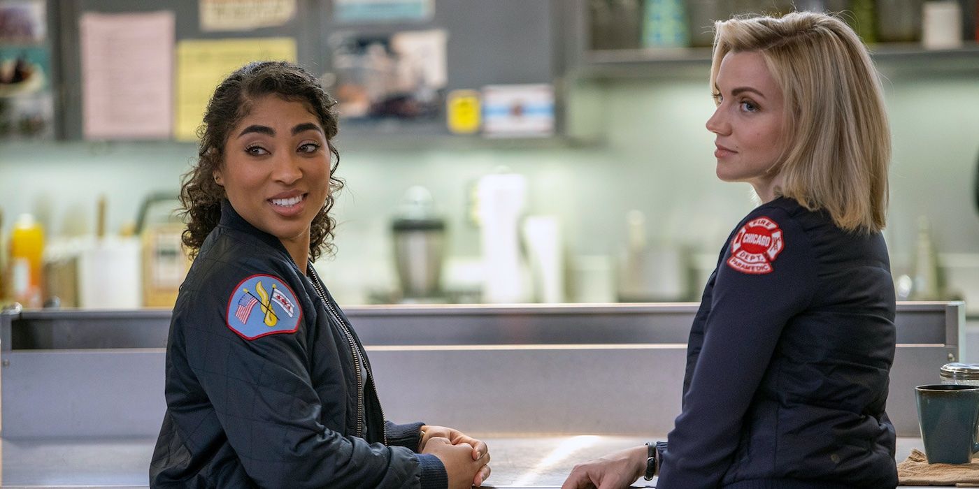 Gianna Mackey (Adriyan Rae) and Sylvie Brett (Kara Killmer) standing in the firehouse kitchen in Chicago Fire.