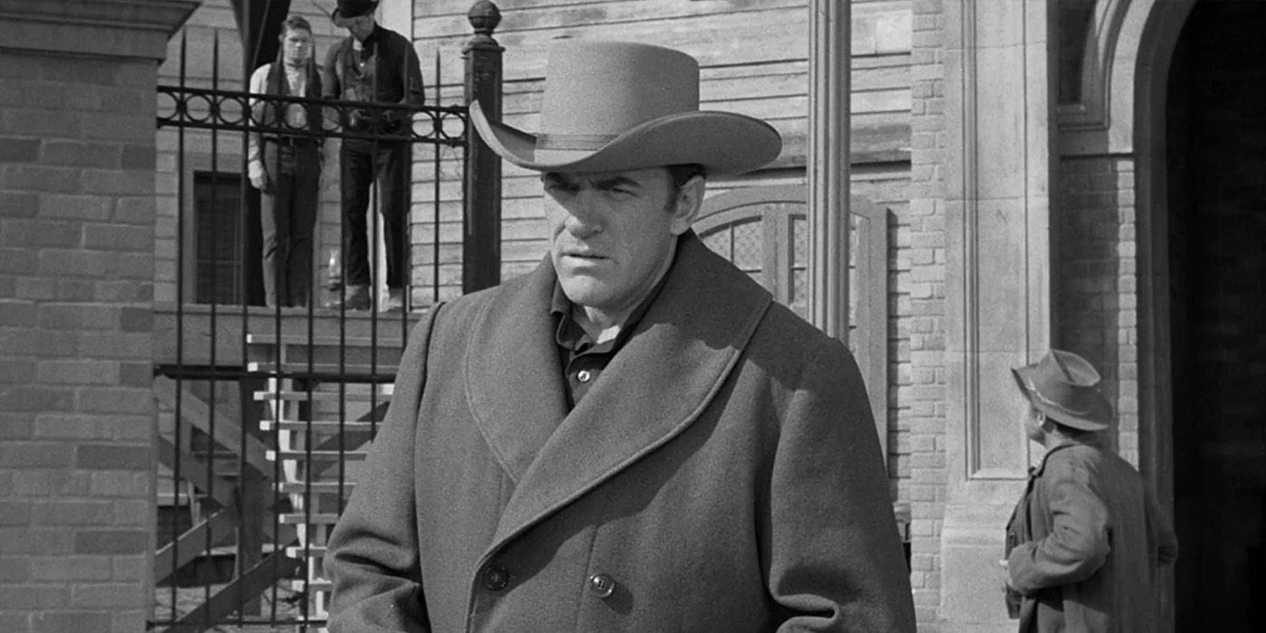 Marshal Matt Dillon (James Arness) walks away from the gallows as Pruitt Dover (Jeremy Slate) is about to be hung in the 'Gunsmoke' episode "The Gallows."