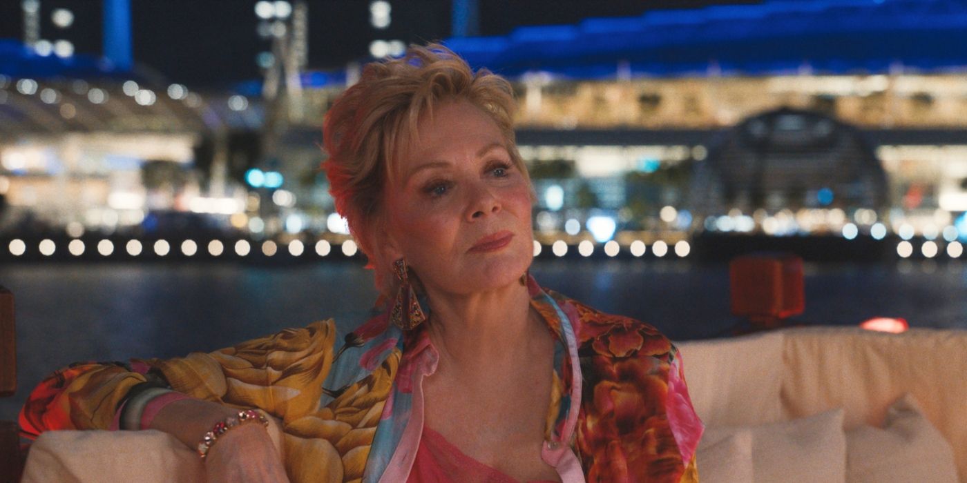 Jean Smart looking at someone off-screen, sitting outside at night in Hacks Season 4 finale.