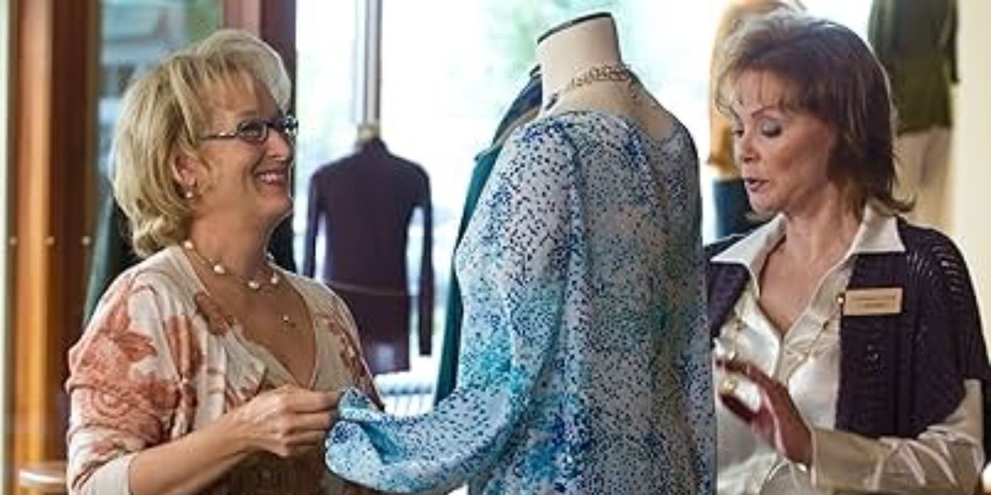 Meryl Streep and Jean Smart in a clothing store looking at a blouse on a mannequin in Hope Springs.