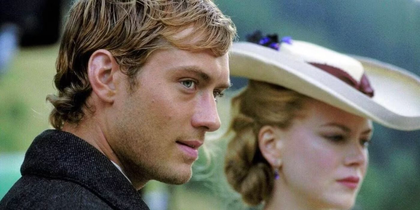 Jude Law stands next to Nicole Kidman, neither one looking at each other in Cold Mountain.