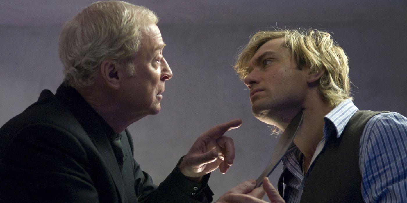 Michael Caine holds a knife to Jude Law's throat in Sleuth.