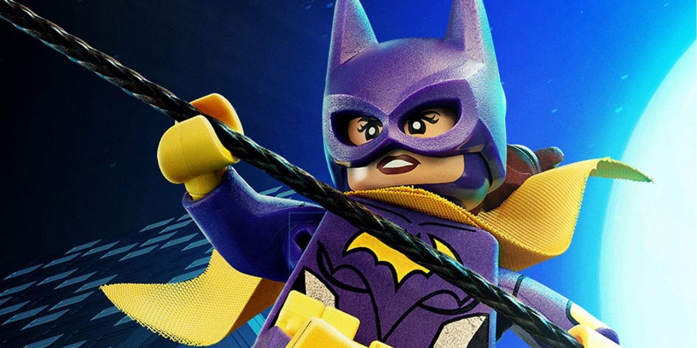 Batgirl, voiced by Rosario Dawson, swings from a rope in front of the moon in The Lego Batman Movie.