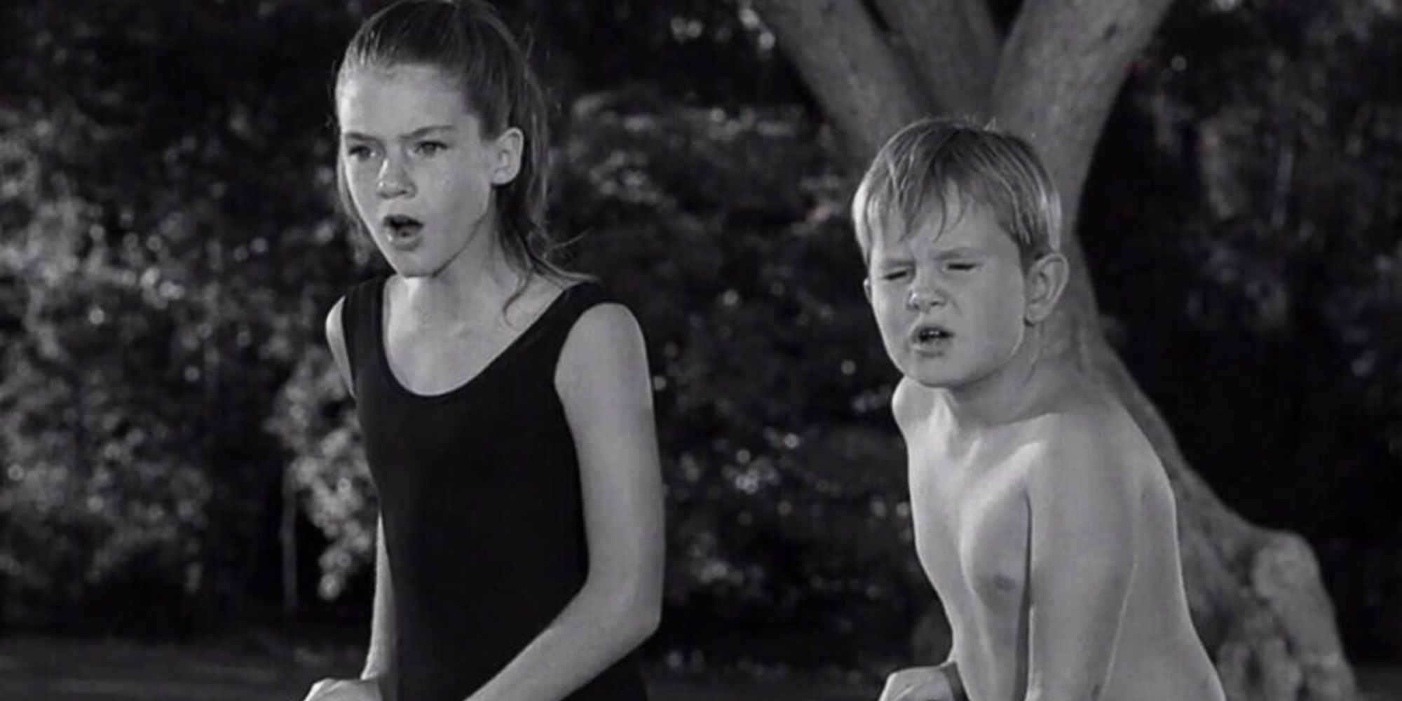 Mary Badham standing next to Jeffrey Byron in The Twilight Zone episode The Bewitchin' Pool