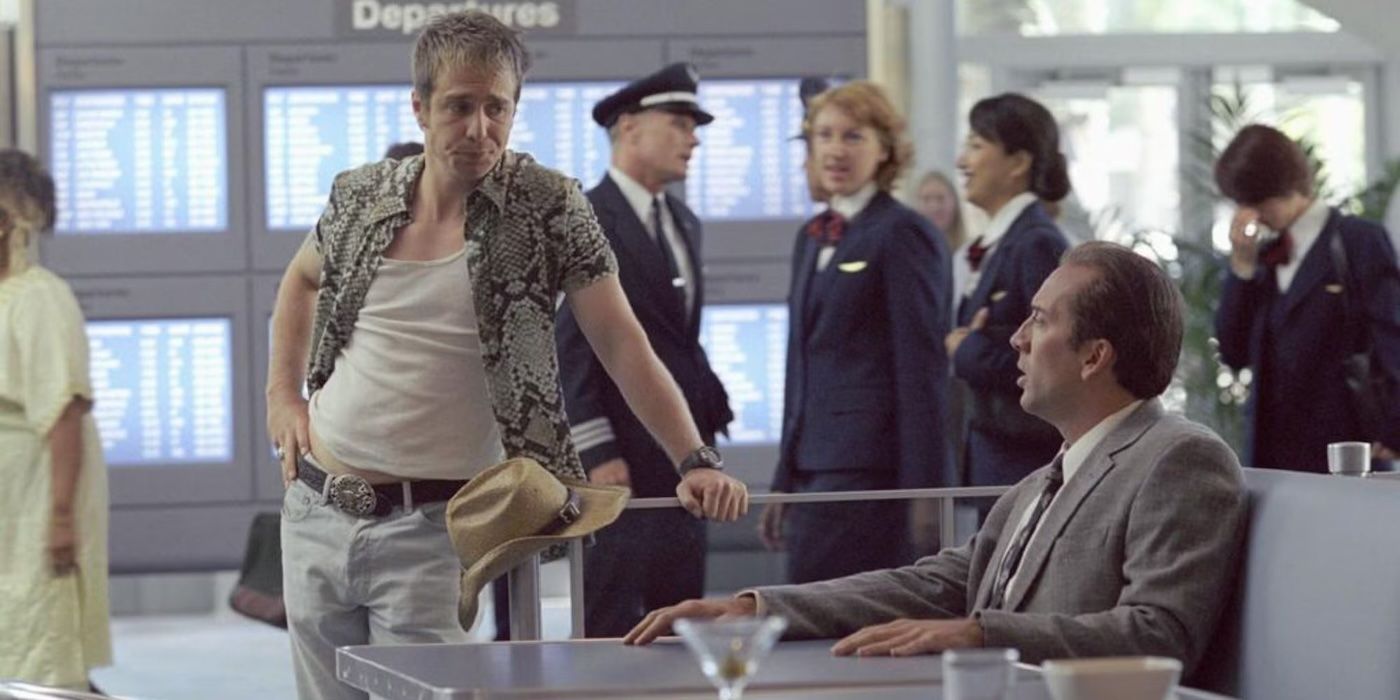 Sam Rockwell and Nicolas Cage talk to each other in an airport in Matchstick Men.