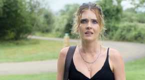 Meghann Fahy wearing a black tank top and looking disheveled in Sirens