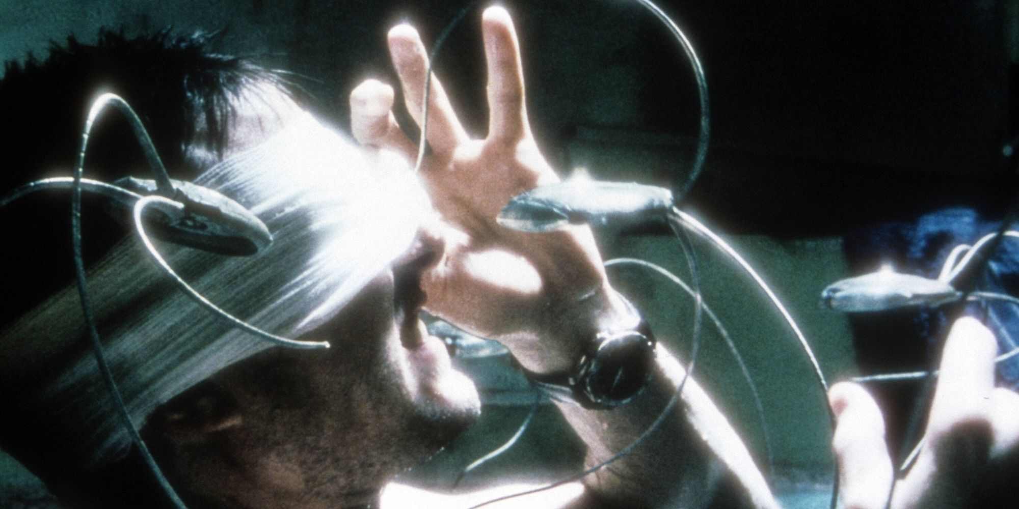 Tom Cruise removes eye bandages to be scanned by a surveillance drone in Steven Spielberg's 'Minority Report'