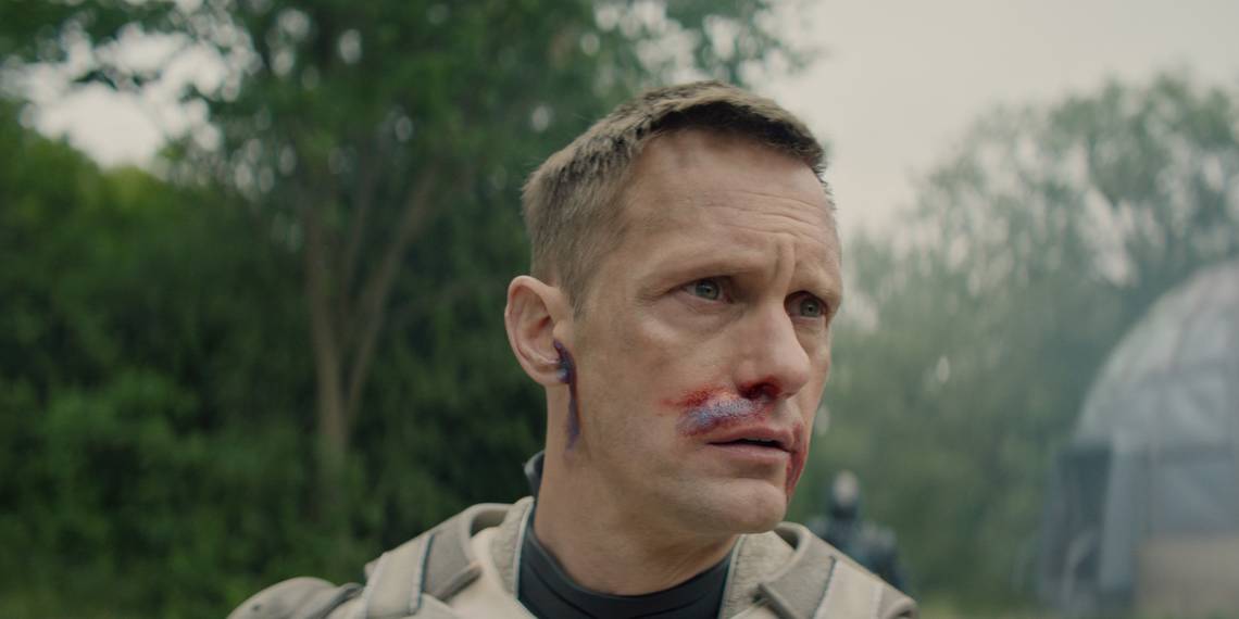 Alexander Skarsgård bloodied and bruised in Murderbot Episode 4
