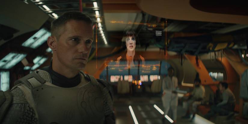 Alexander Skarsgård watching a TV show in Murderbot Episode 3