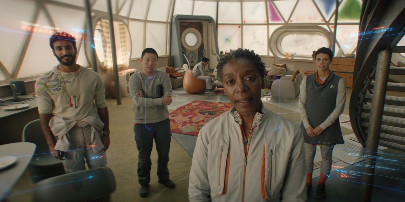 Murderbot's POV looking back at Mensah (Noma Dumezweni), Ratthi (Akshay Khanna), Pin-Lee (Sabrina Wu), and Arada (Tattiawna Jones)