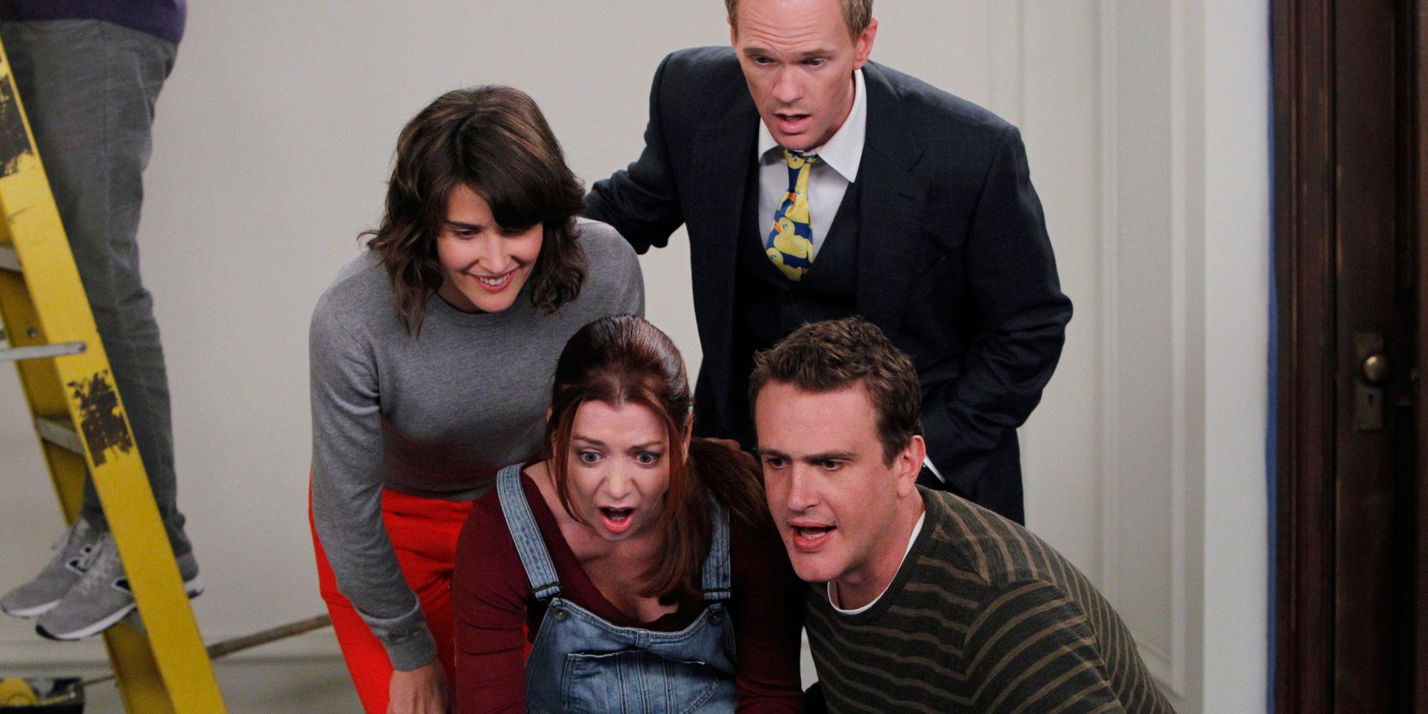 Robin, Lilly, Barney, and Marshall look shocked while looking up Ted's date in How I Met Your Mother "Mystery vs History." A man stands on a ladder in the background.