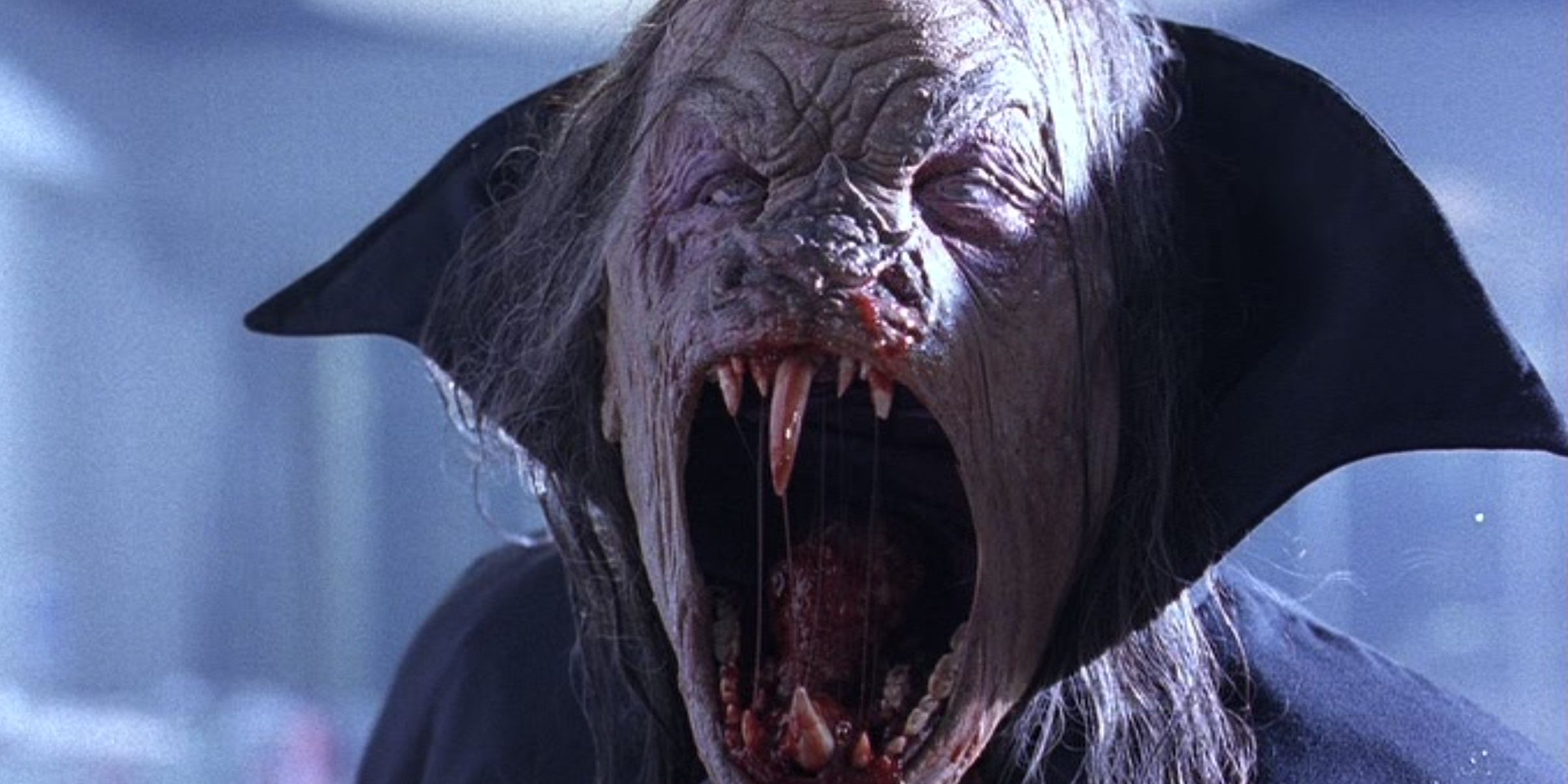 The vampire opening his mouth and scowling in The Night Flier