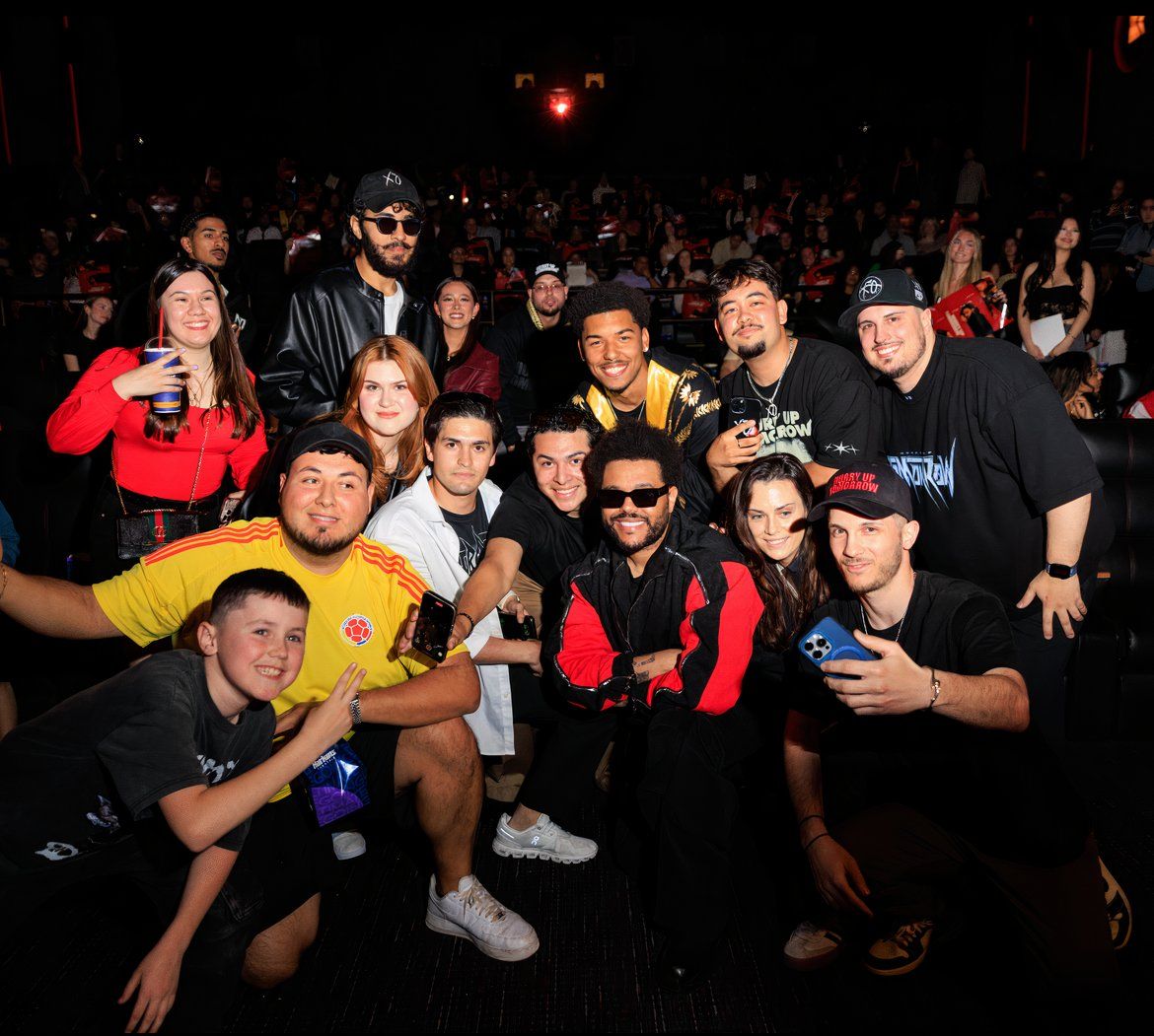 The Weeknd posing with his fans during a surprise appearance at an early screening of Hurry Up Tomorrow