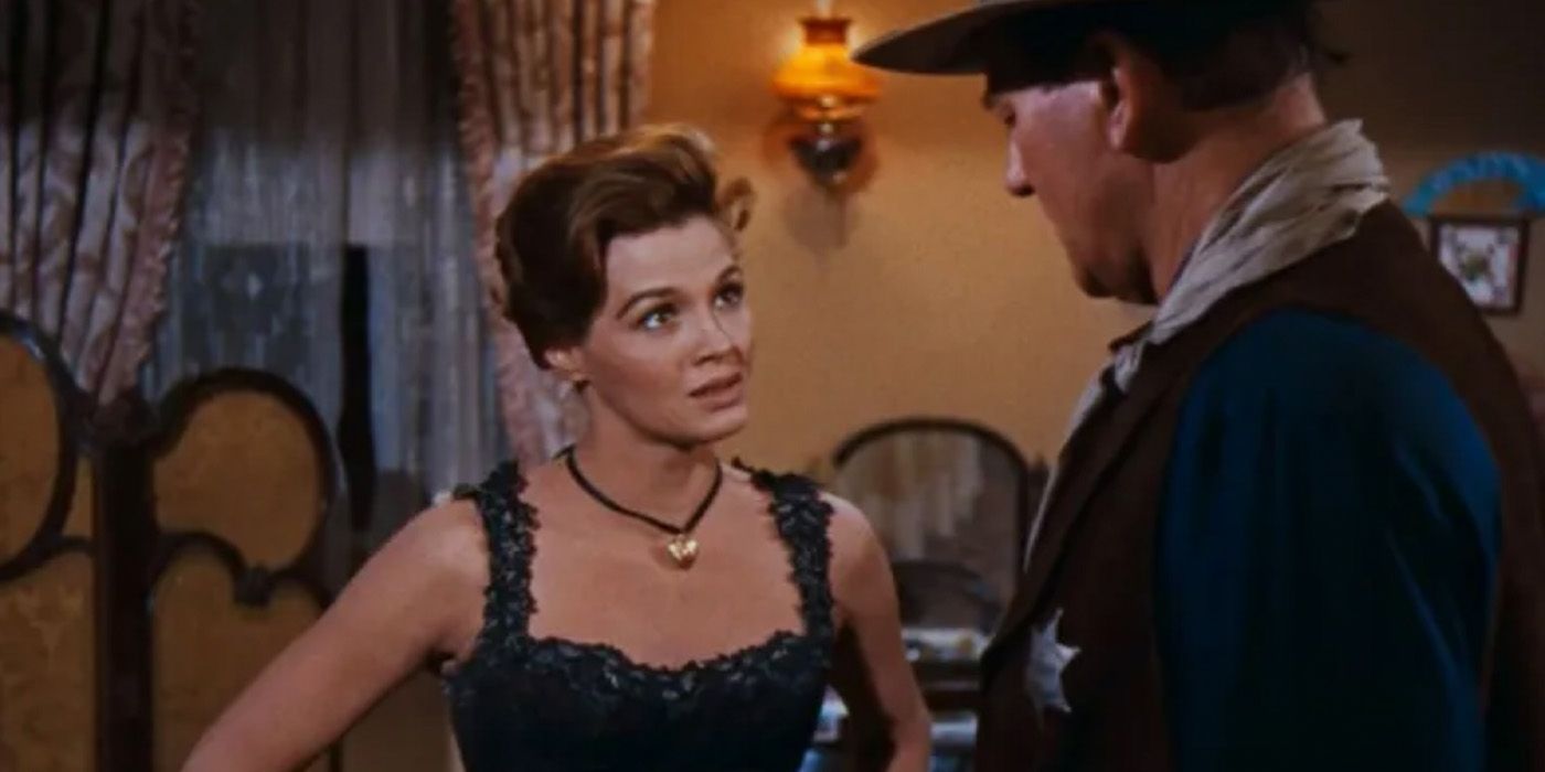 Feathers (Angie Dickinson) speaks with John T. Chance (John Wayne) in 'Rio Bravo'
