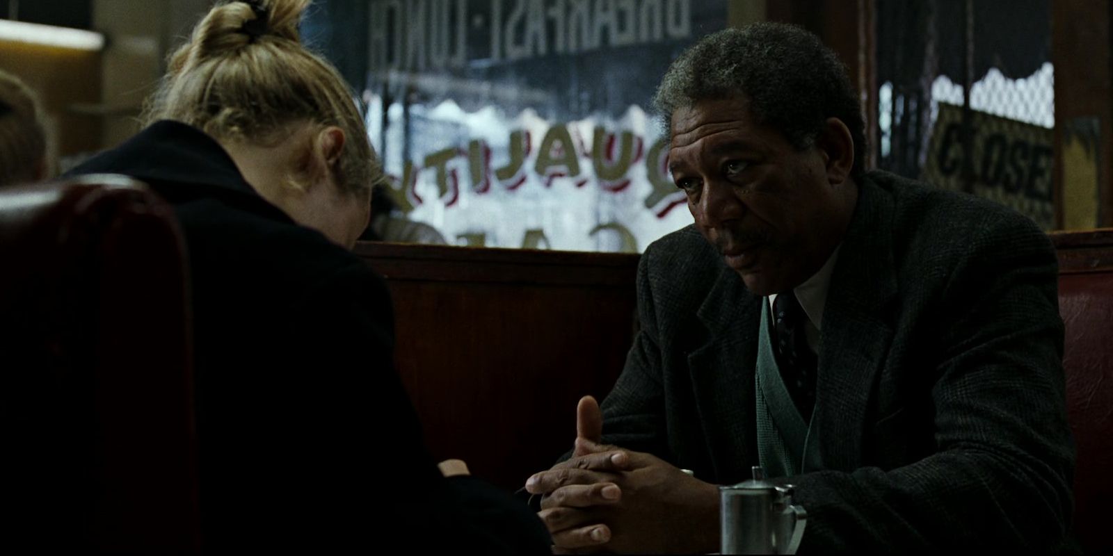 Gwyneth Paltrow and Morgan Freeman sit at a diner in David Fincher's 'Se7en'