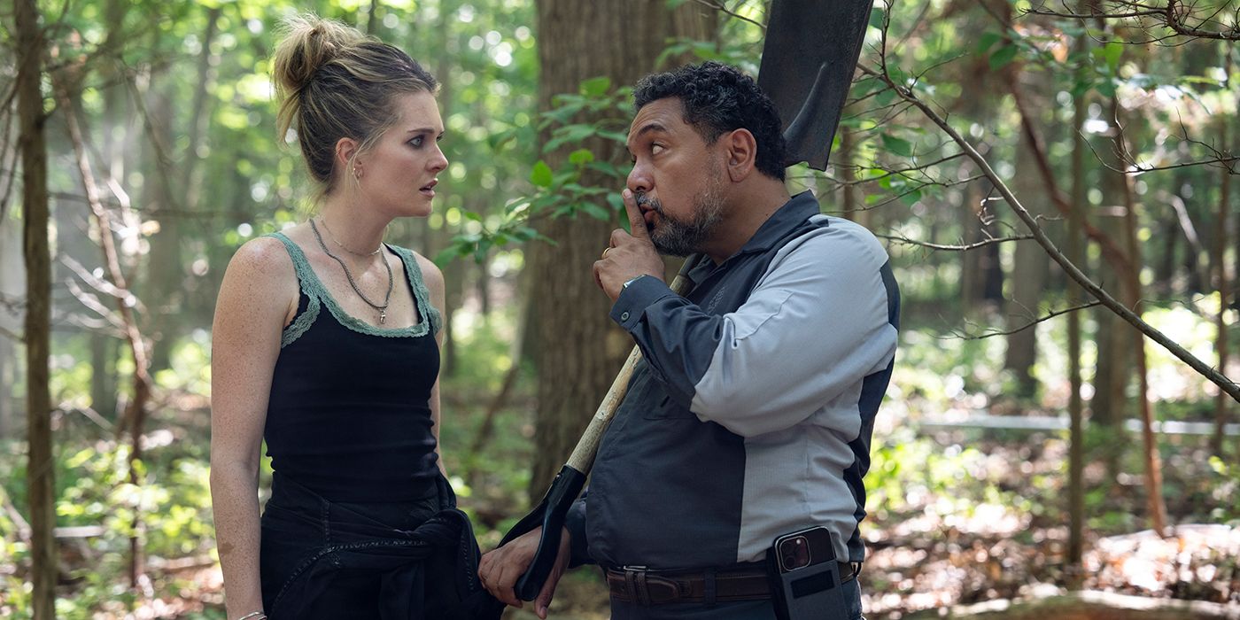 Felix Solis shushing Meghan Fahy in the forest in Sirens