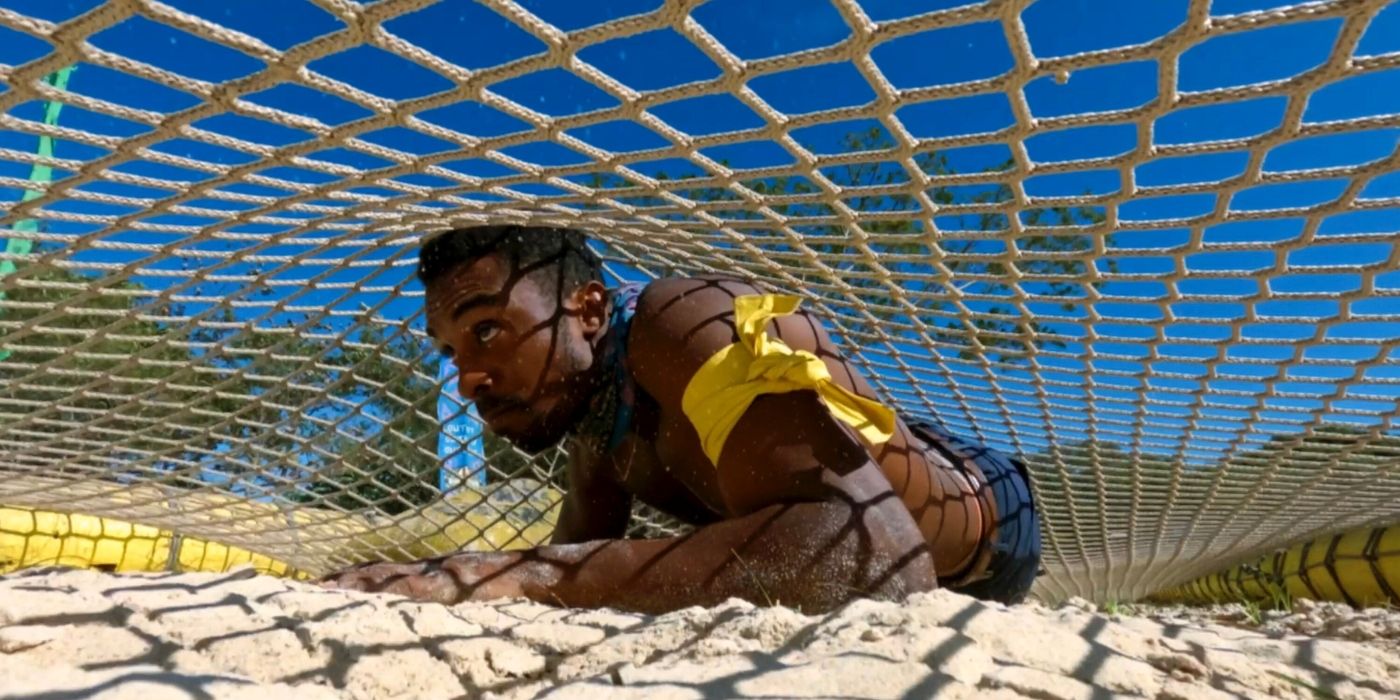 Kyle crawls under the net on 'Survivor 48.'