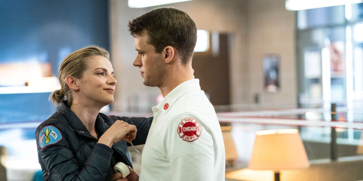 Sylvie Brett (Kara Killmer) and Matt Casey (Jesse Soffer) in work attire, sharing a moment in Chicago Fire.