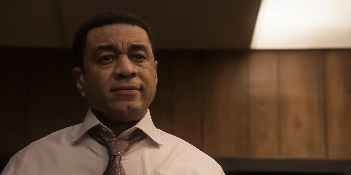 Harry Lennix as Harold Cooper in a business shirt and tie, looking slightly perplexed in The Blacklist.