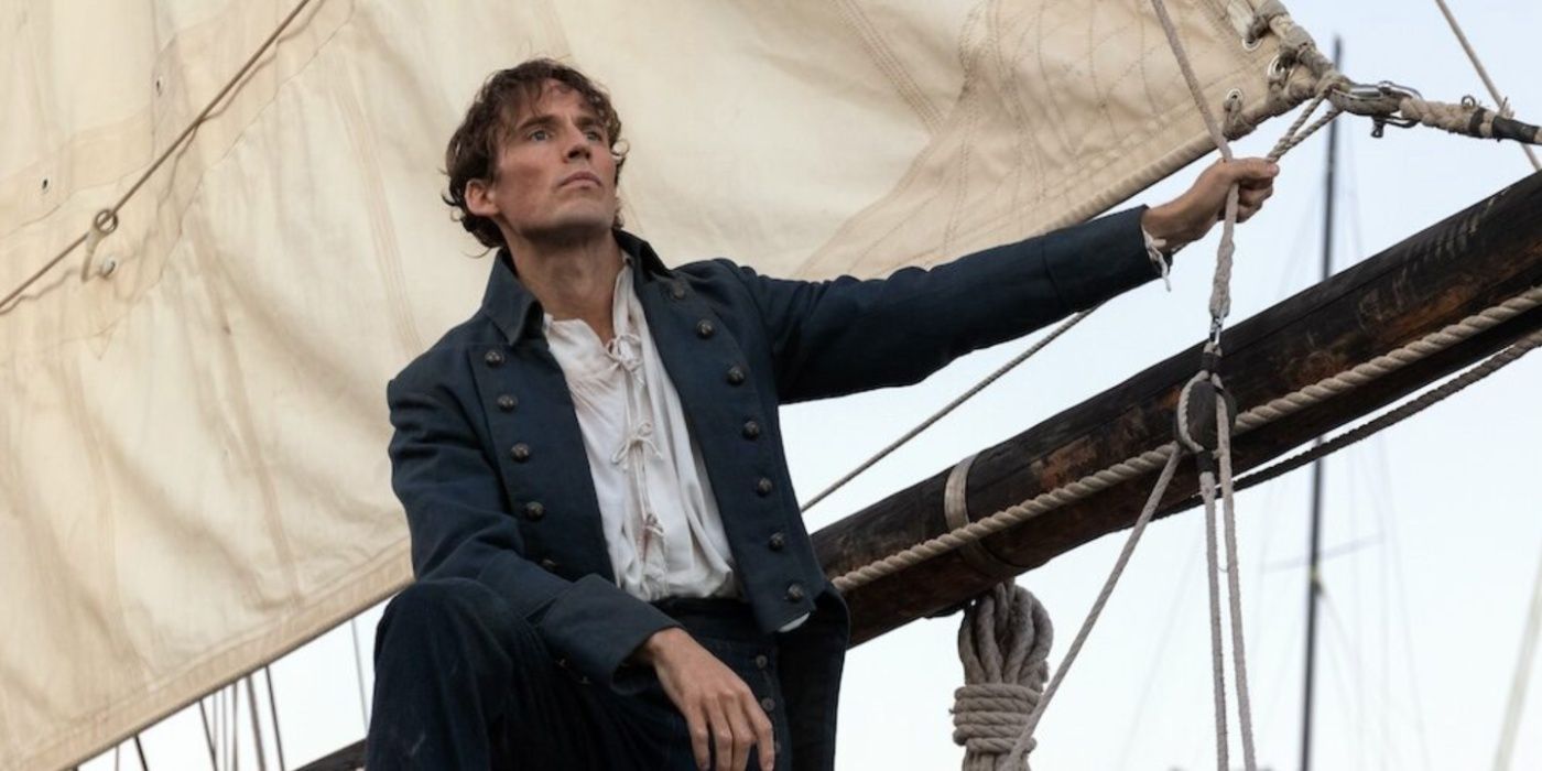 Sam Claflin olha para a distância enquanto está em um navio na contagem de Monte Cristo.