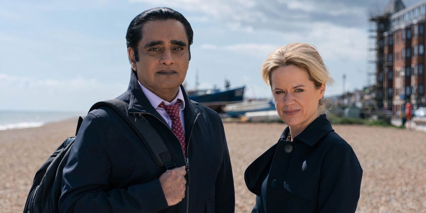 Sanjeev Bhaskar as DI Sunny Khan and Sinéad Keenan as DCI Jess James stand on the shore in Unforgotten Season 6