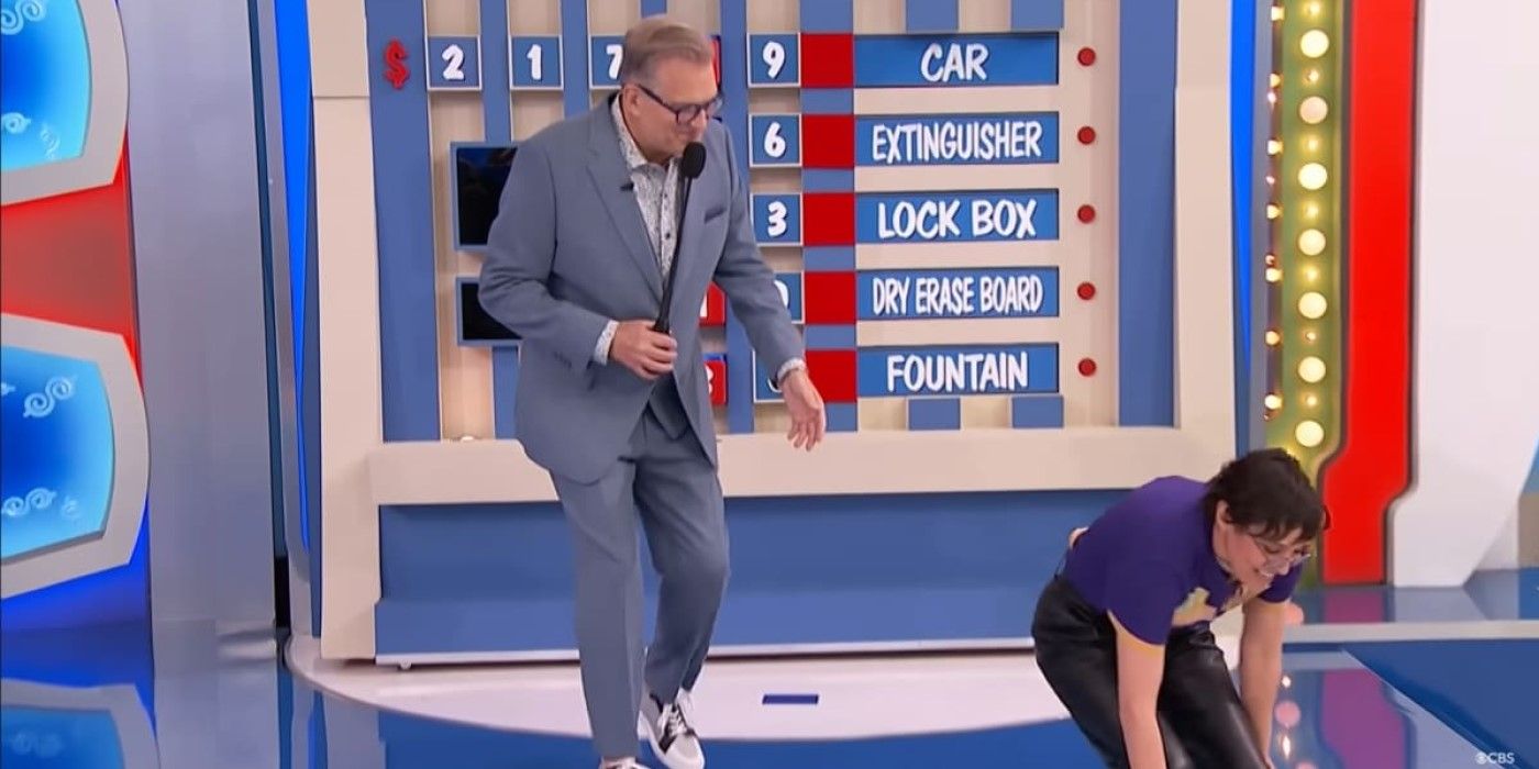 Yanira from Hawaii chases the Switcheroo block as Drew Carey tries to help on The Price is Right.