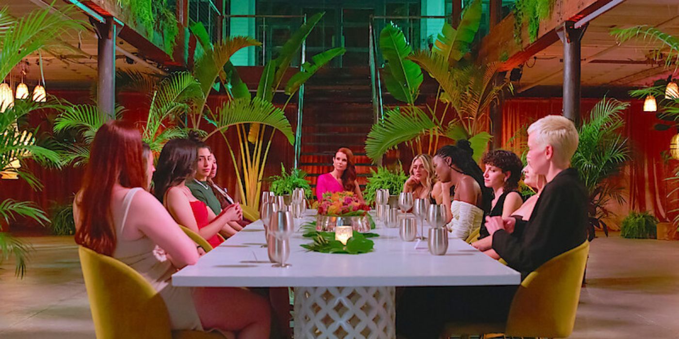 The entire cast of The Ultimatum: Queer Love sitting at a dinner table.