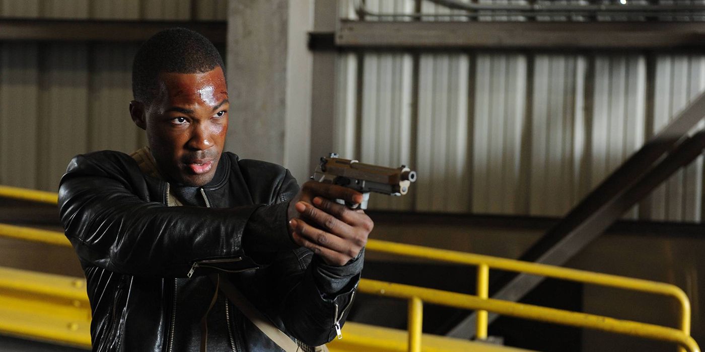A sweaty man wielding a gun in 24: Legacy.