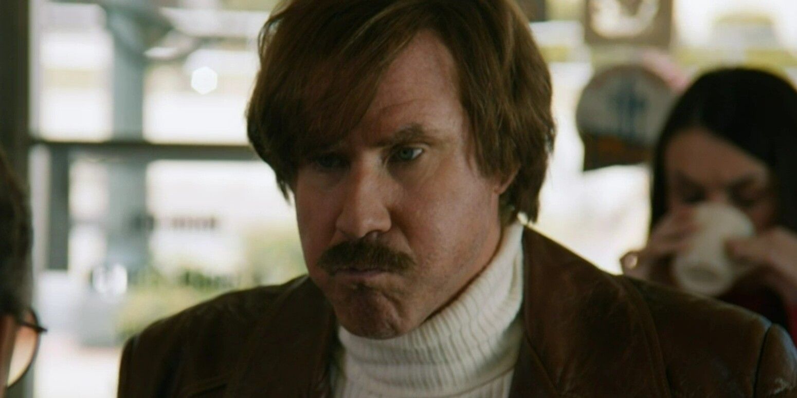 Will Ferrell as Ron Burgundy in Anchorman 2: The Legend Continues with a mouth full of food eating breakfast at a diner.