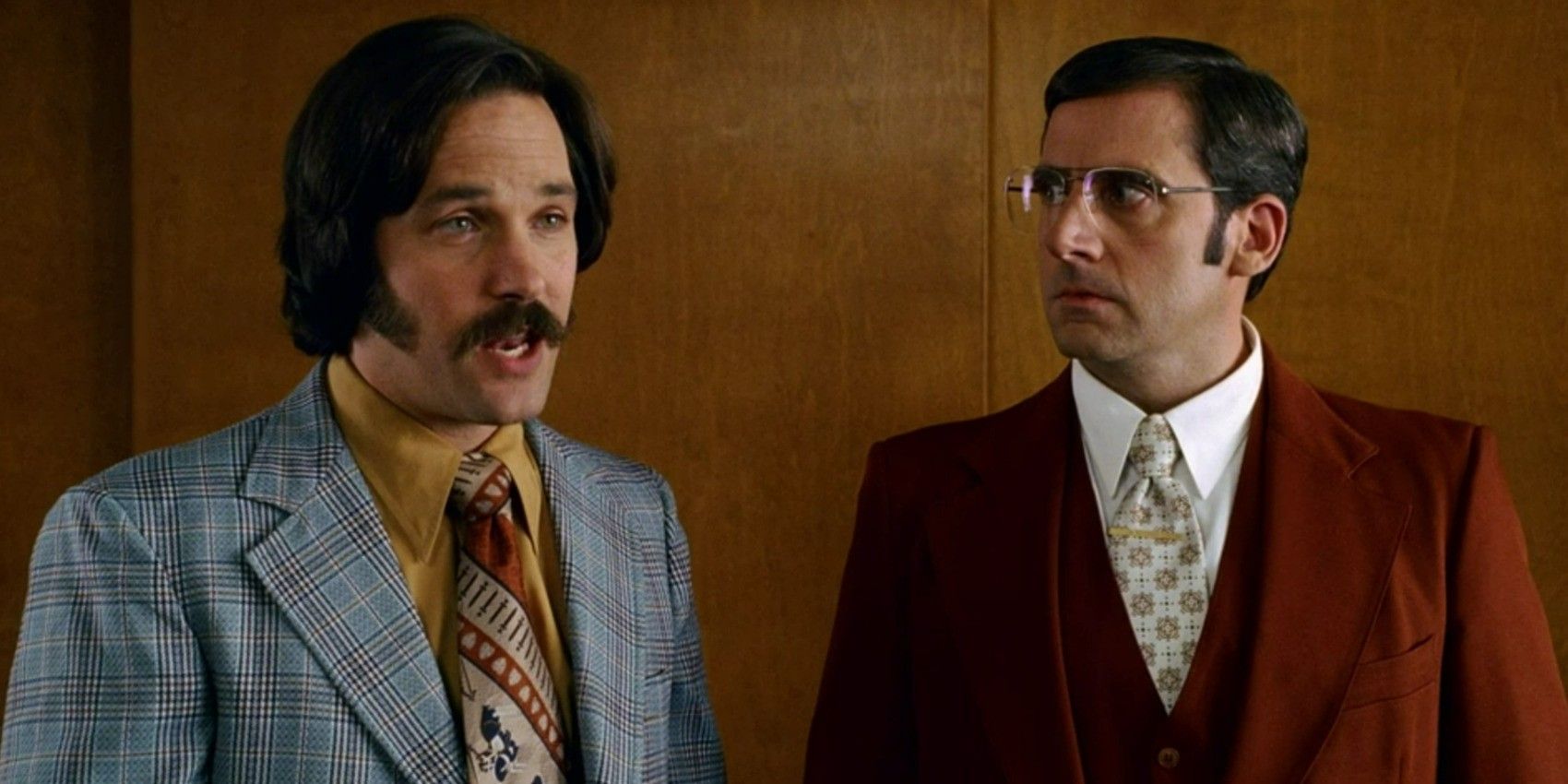 Paul Rudd as Brian Fantana and Steve Carell as Brick Tamland in Anchorman: The Legend of Ron Burgundy discussing the meaning of love.