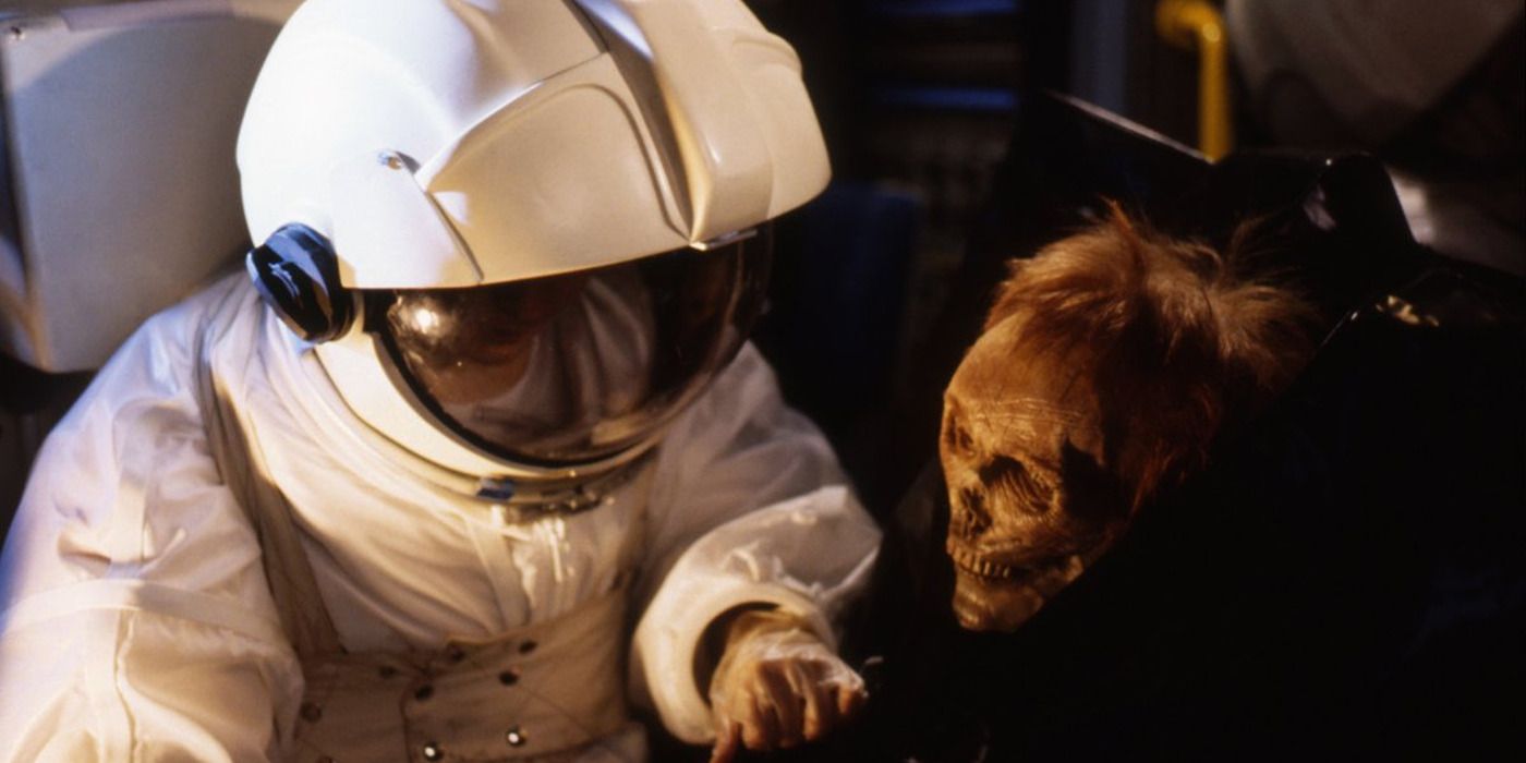 Astronaut examining dead body in 'Star Cops'