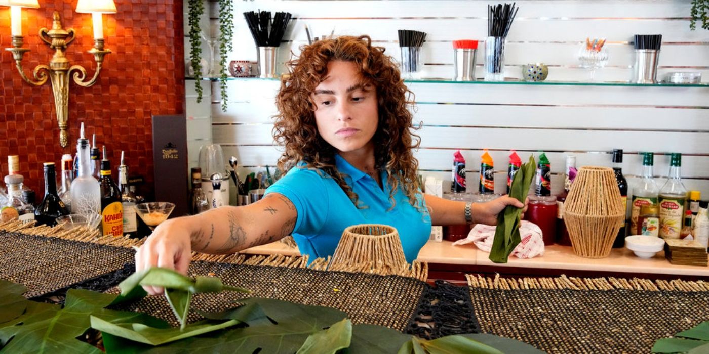 Stewardess Barbara Kulaif cleans the bar on 'Below Deck' Season 12.