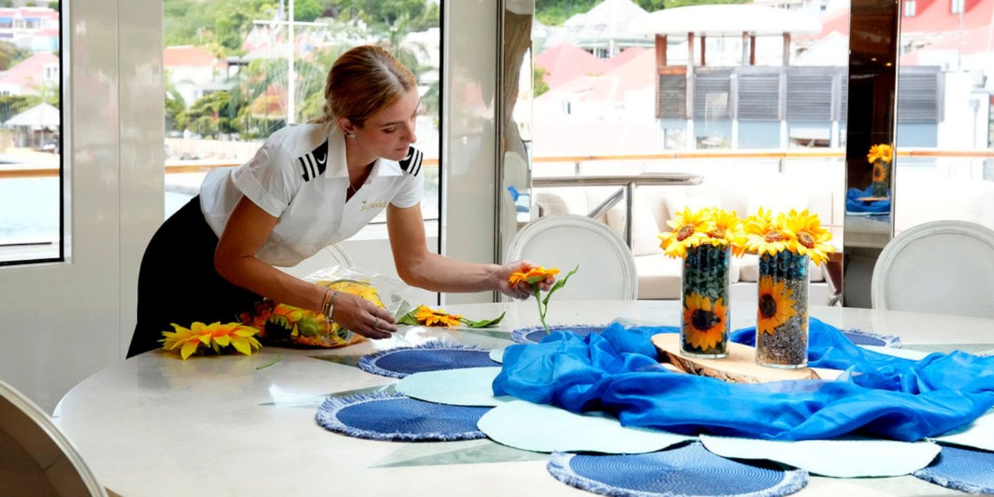 Rainbeau De Roos decorates the table on 'Below Deck' Season 12.