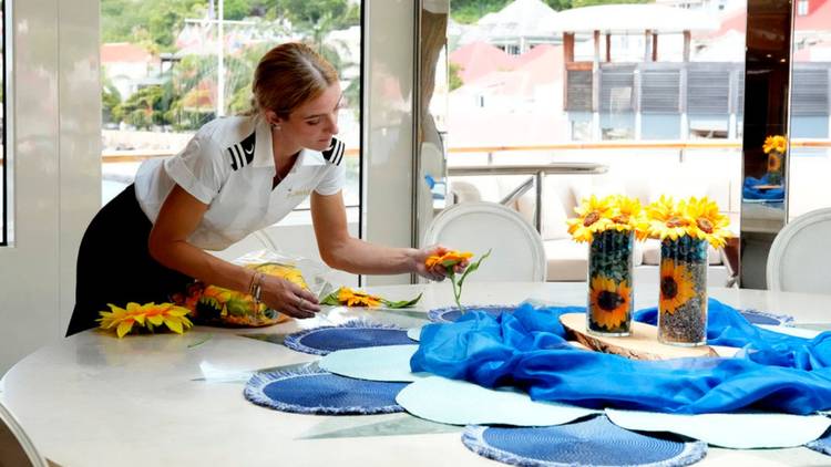 Rainbeau De Roos decorates the table on 'Below Deck' Season 12.