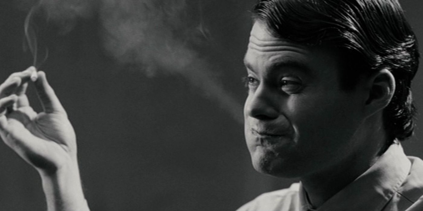 Bill Hader blowing smoke from his puffed up lips and holding a cigarette in Pineapple Express