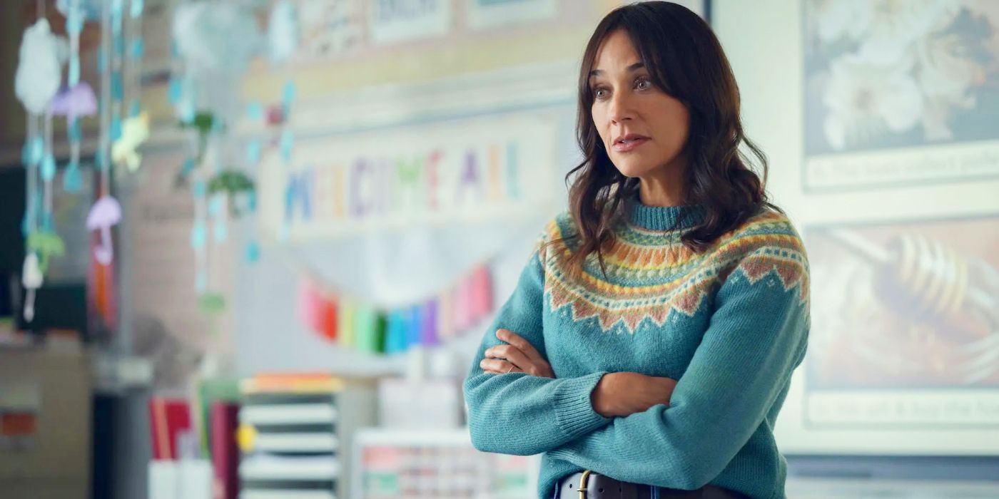 Rashida Jones teaching a class with her arms crossed in Black Mirror Season 7, Common People.