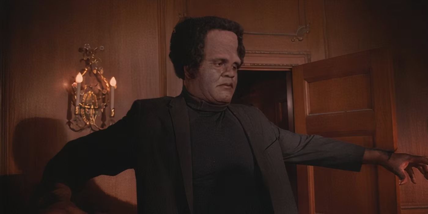 A Frankenstein-looking person lumbers through a room in Blackenstein.